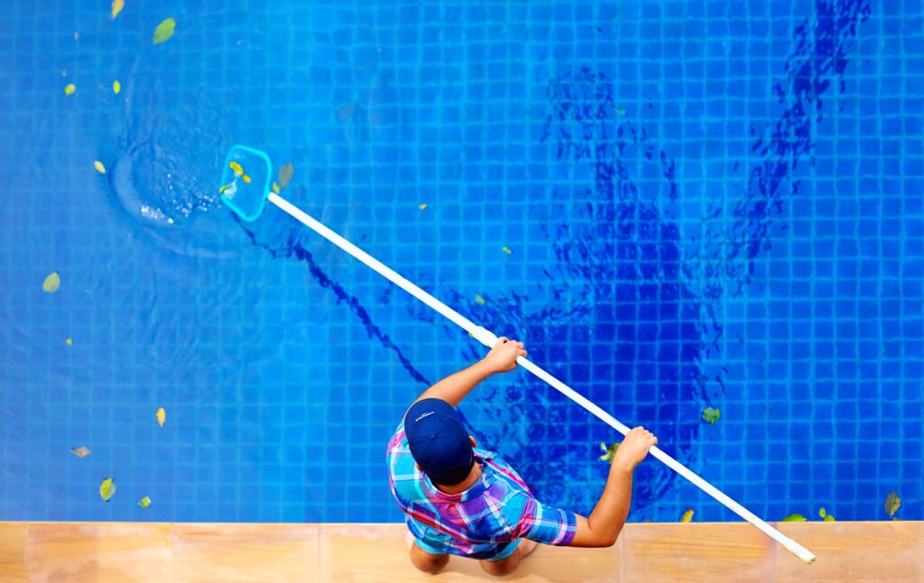 guy cleaning the pool